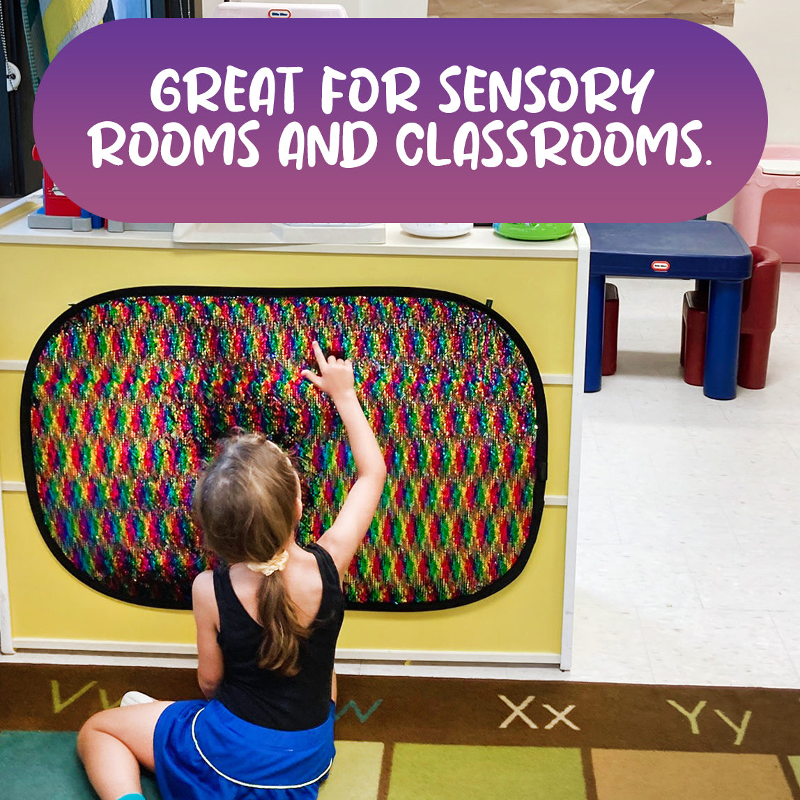 Child using the Giant Reversible Rainbow Sequins Toy mounted in a sensory room or classroom