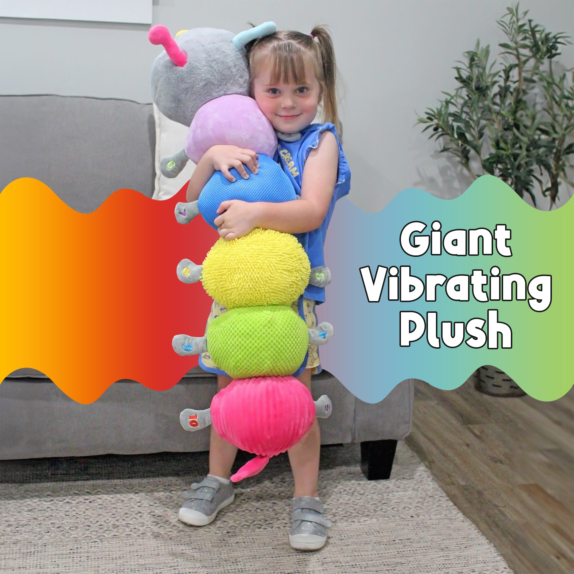 Child holding the giant CuddleBug vibrating sensory caterpillar to show its colorful textured sections
