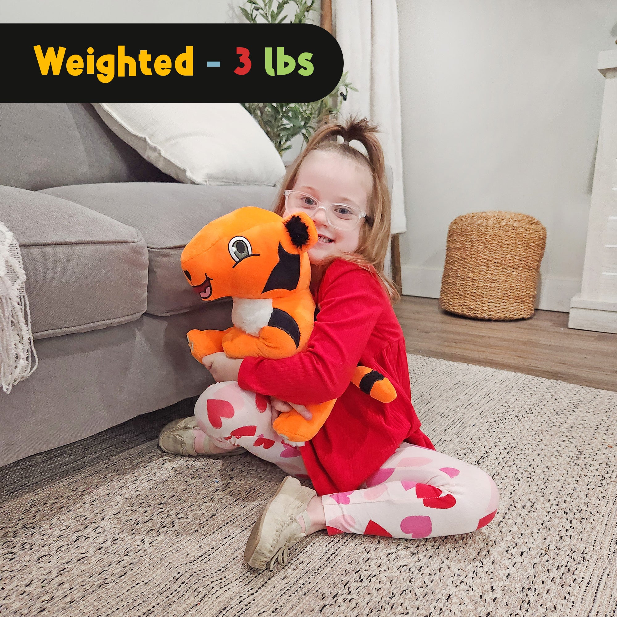 Child hugging TAT the Autistic Tiger Weighted Sensory Plush showing its 3 lb weighted design